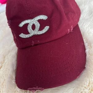 CHANEL Maroon Hat with Silver Emblem
